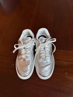CHANEL women’s Silver Metallic Lace-Up Sneakers
